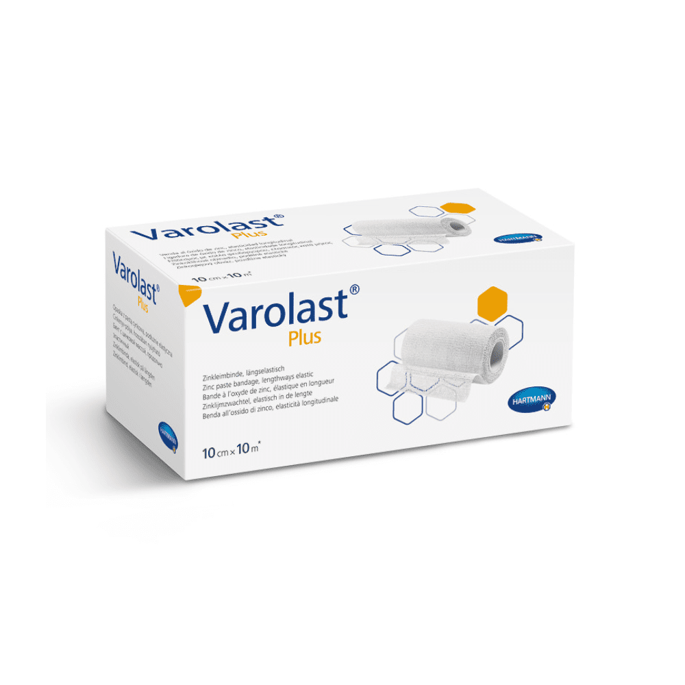 The image shows a rectangular white box containing Hartmann Varolast® Plus zinc adhesive bandages. The packaging features an image of a rolled-up bandage and hexagonal motifs. Ideal for treating edema and phlebitis; the dimensions listed on the box are 10 cm x 10 m. The Paul Hartmann AG logo is visible in the lower right corner.