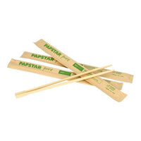 Three couples PAPSTAR "Pure" chopsticks, 23 cm, individually wrapped in paper sleeves with green printing, as found in the 50-pack from PAPSTAR GmbH are depicted on a white background.