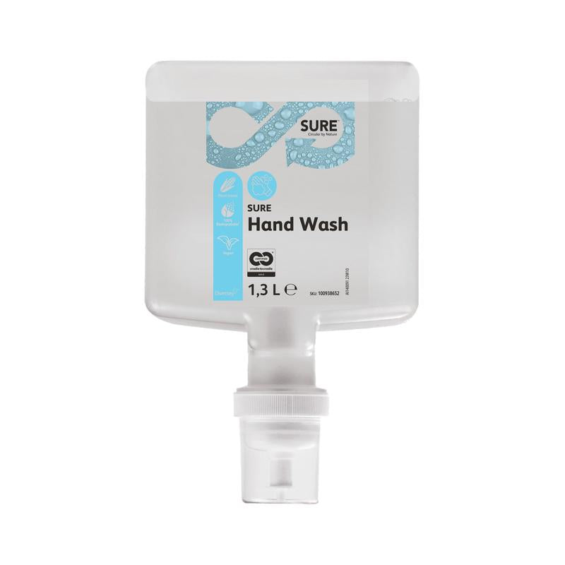 A transparent 1.3-liter plastic dispenser SURE Hand Wash from Diversey Deutschland GmbH & Co. OHG with a blue-white label and white bottom nozzle contains environmentally friendly hand soap made from natural ingredients.
