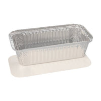The Starpak 5 trays—aluminum with PE-coated lids, rectangular—from Starpak are displayed on a white rectangular serving board, both set against a plain white background—perfect for use in the foodservice industry.