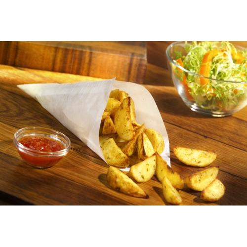 Potato wedges in the PAPSTAR 1000 cone bags parchment substitute greaseproof from the PAPSTAR GmbH are on a wooden board, served with red dip sauce and a bowl of green salad with orange peppers.