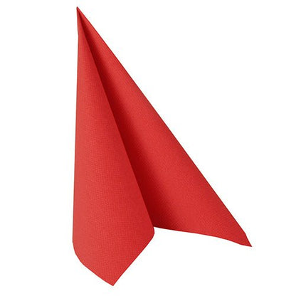 A red napkin from the PAPSTAR 50 napkins "ROYAL Collection", 1/4-fold, 40 x 40 cm, is set up in a triangular tent-like shape against a white background.