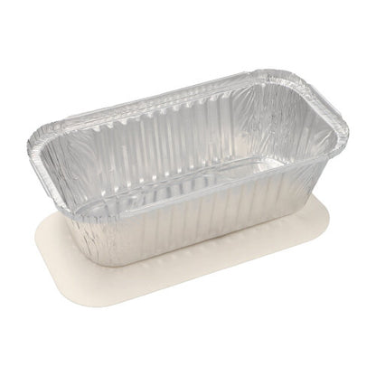 A Starpak 25 tray, aluminum + insert lid, PP-coated disposable aluminum foil container with slightly wavy edges stands empty on a white surface.