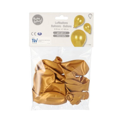 A transparent plastic packaging with 10 PAPSTAR balloons Ø 25 cm from PAPSTAR GmbH, containing several empty golden latex balloons. The label shows images of the inflated golden balloons and product details in various languages – ideal for any decoration.