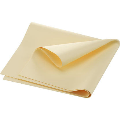 A single sheet of uncooked lasagna noodles is folded multiple times and placed on a white background reminiscent of Dunilin napkins 40 x 60 cm 1/4 fold by Duni GmbH.