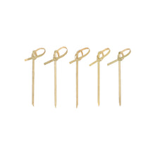 Forty PAPSTAR 40 finger food picks "pure" from PAPSTAR GmbH made of bamboo with pointed ends and looped knots stand neatly and evenly upright on a simple white surface, ideal for serving finger food.