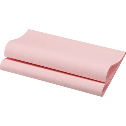 A folded sheet of light pink, textured paper resembling the Bio-Dunisoft napkins 40 x 40 cm 1/4 fold from Duni GmbH stands against a white background. The biodegradable napkin has a visible grain and clear edges - ideal for the elegantly set table.