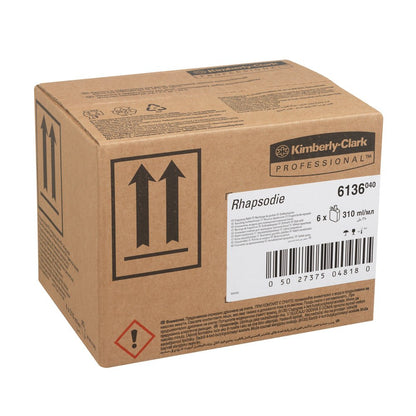A brown cardboard box labeled "Kimberly-Clark Professional™ RHAPSODIE Fragrance Refill Pack/Transparent/310 ml - 6 Cartridges" from Kimberly-Clark GmbH, ideal for washroom air fresheners or toilet fragrance dispensers, with product details and warning symbols.