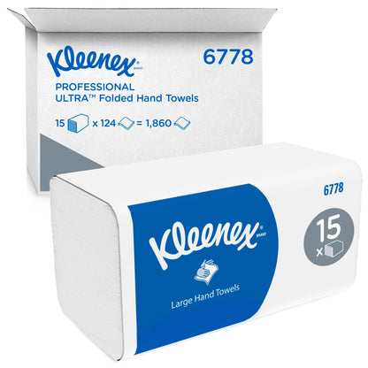 Eine Kleenex® Falthandtücher Weiß/Groß-Packung der Kimberly-Clark GmbH steht vor einem Marken-Versandkarton, beide mit 15 Clips x 124 Blatt pro Karton (15 Packungen), insgesamt 1.860 Tücher.