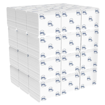 A large stack of Kleenex® toilet paper single sheet system (36 x 200 sheets), each in white packaging with a blue Kimberly-Clark logo, neatly arranged in a cube.