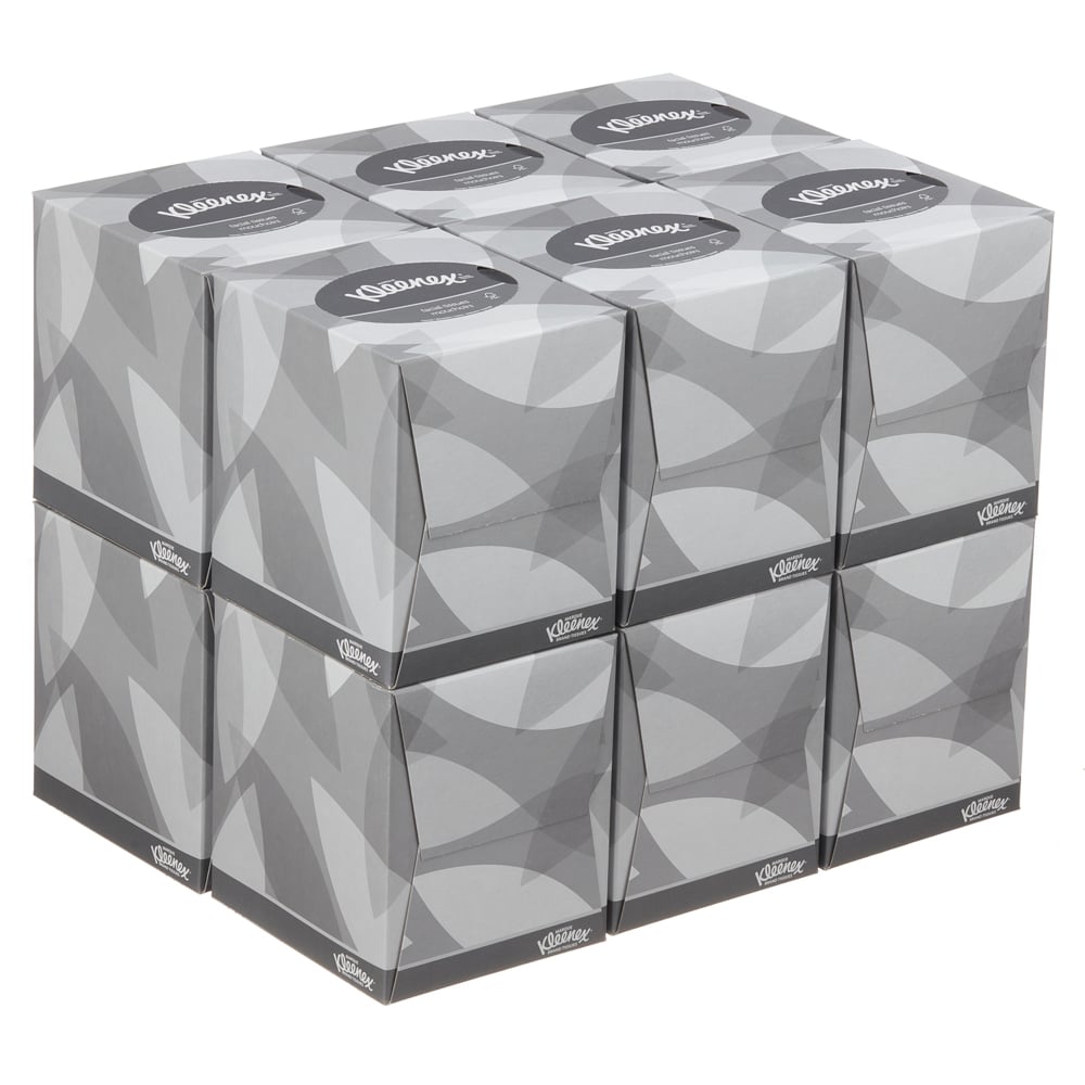 A stack of nine Kleenex® facial tissues - cube box / white from Kimberly-Clark GmbH, arranged in three rows and columns with a gray geometric design, is ideal for facial care.