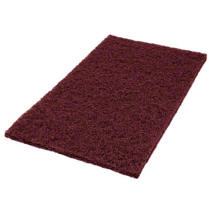 The Twister Pad purple, square from Diversey Deutschland GmbH & Co. OHG for the maintenance cleaning of coated hard floors has a rough surface and is rectangular and burgundy on a white background.