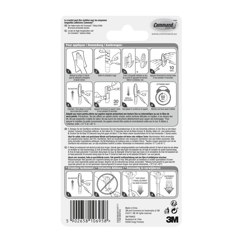 The back of the 3M Deutschland GmbH Command™ Medium Designer Hook in metal look, 17081BN packaging shows a pictorial, multilingual guide for attaching and removing the strong hook, as well as a barcode at the bottom.
