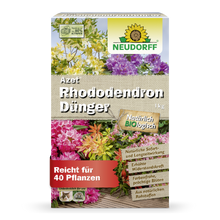 Eine 1 kg schwere, rechteckige Schachtel Azet RhododendronDünger von Neudorff Shop ist mit blühenden Blumen, deutschen Produktinformationen und einem grün-gelben Neudorff-Logo versehen und damit ideal für Rhododendron und Azaleen.