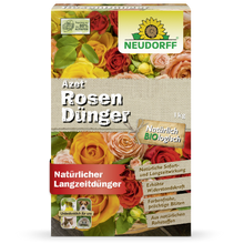 Vorderansicht einer 1 kg-Packung Neudorff Shop Azet RosenDünger, einem organischen Rosendünger. Die Verpackung zeigt blühende Rosen und wirbt mit Vorteilen wie erhöhter Widerstandsfähigkeit und leuchtenden Blüten.
