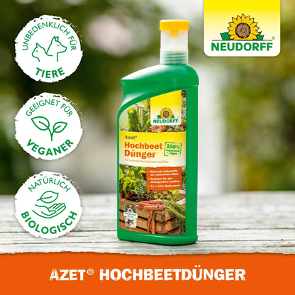 A green bottle of Neudorff Shop Azet Raised Bed Fertilizer liquid stands on a wooden rack with plants behind it. Pictograms indicate that it is cruelty-free, vegan, and as an organic liquid fertilizer rich in natural nutrients.