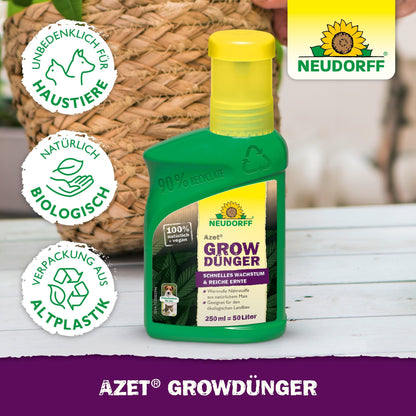 A green bottle of Azet GrowFertilizer from Neudorff Shop rests on a white wooden surface, featuring symbols for environmental and animal protection. The label advertises natural, organic ingredients and packaging made from recycled plastic.