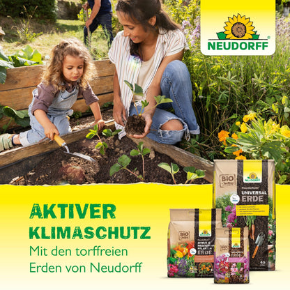 A woman and a young girl plant seedlings in a garden bed. In the foreground are bags with NeudoHum Grow All-Mix from the Neudorff Shop, with text about peat-free soil for climate protection. The Neudorff logo is visible in the corner.