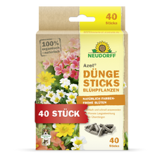 Vorderansicht einer Schachtel Neudorff Shop Azet Düngesticks für Blühpflanzen mit Blumenabbildungen, Produktangaben, einem Etikett für 40 Sticks und einer Verpackung in Gelb mit grünen und roten Akzenten.