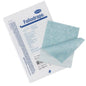 A package of Paul Hartmann AG Foliodrape surgical adhesive strips 10x50 (package, 115 pieces) lies next to two unfolded blue and white cloths for securing surgical drapes in sterile operating environments.