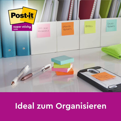 A tidy desk shows folders labeled with colorful Post-it® Super Sticky Notes (47.6 mm x 47.6 mm, 90 sheets/block, 100% PEFC) from 3M Deutschland GmbH. Above the Post-it Super Sticky logo is the text "Ideal for organizing".