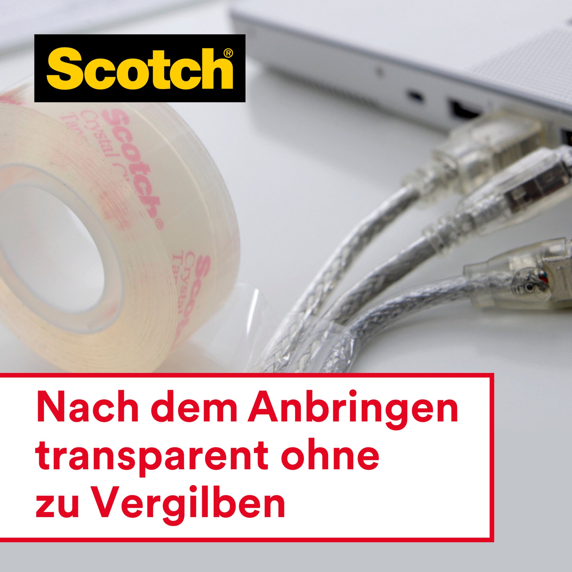Eine Rolle Scotch® Crystal Klebeband (12 mm x 10 m) der 3M Deutschland GmbH mit Handabroller steht neben einem silbernen Laptop und drei Netzwerkkabeln. Deutscher Text: "Nach dem Anbringen transparent ohne zu Vergilben.