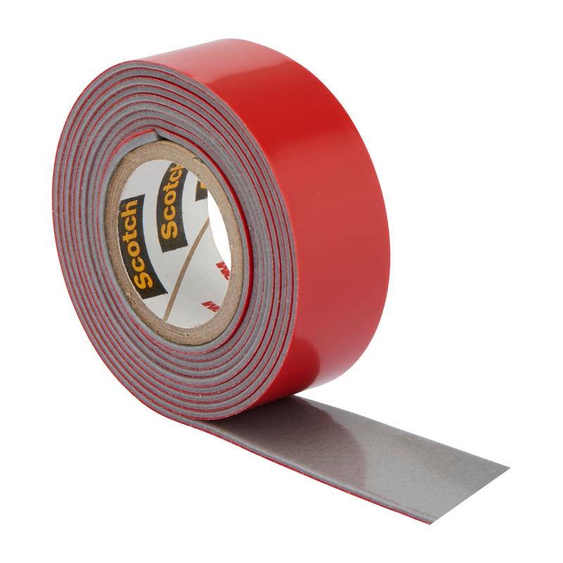 A roll of 3M Deutschland GmbH Scotch-FIX™ Extreme double-sided outdoor mounting tape with a red outer layer and gray adhesive side is partially unrolled and shown against a white background.