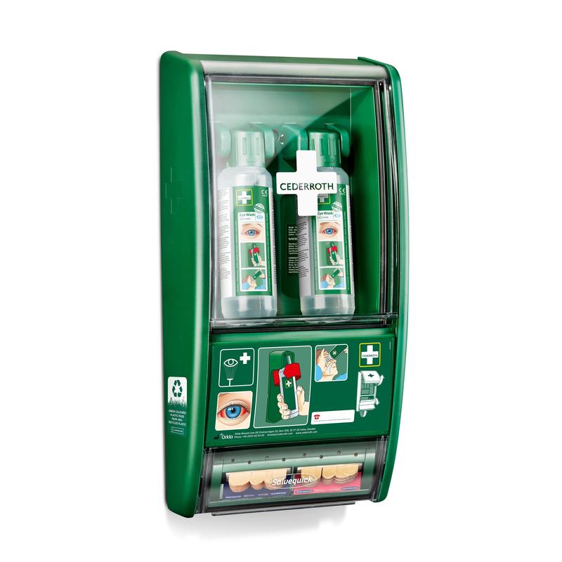 The Orkla Wound Care AB Cederroth eye wash station consists of two 500 ml bottles (725200) and a Salvequick plaster dispenser (490700), all secured behind a transparent cover on the wall, where the instructions for use and the brand name are visible.