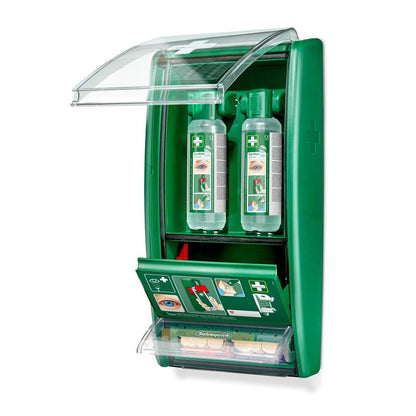 A green, wall-mounted Cederroth eye wash station from Orkla Wound Care AB with 2 x 500 ml bottles (725200), a Salvequick plaster dispenser (490700), transparent lid, labels, and a compartment for first aid materials is shown open.