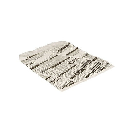 One PAPSTAR GmbH "Newsprint" hamburger bag (16x18 cm, grease-proof) lies flat on a white background. The paper, which is used as a substitute for parchment, features black-and-white newspaper-style text and bold headlines. Package: 300 pieces.