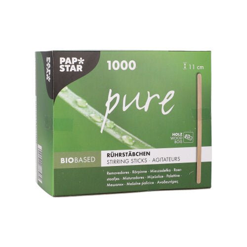 A green-and-white box from the PAPSTAR The GmbH box labeled "pure" contains 1,000 eco-friendly, sturdy wooden stir sticks (11 cm). The folding box features product information in several languages as well as a vertical image of a stir stick.