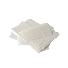 A slightly messy stack of PAPSTAR cream cover paper "pure" 22x16 cm, white, with palm wax coating (2000 pieces) from PAPSTAR GmbH is shown on a plain white background.