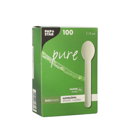 A white box with the inscription "PAPSTAR coffee spoon made of paper 'pure' 13 cm, white, environmentally friendly" from PAPSTAR GmbH contains 100 environmentally friendly coffee spoons made of paper, each 13 cm long; the packaging is provided with an image of the spoon and a note on its organic origin.