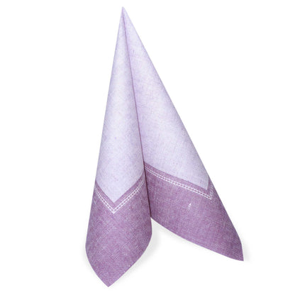 A folded fuchsia-colored [item] stands upright PAPSTAR-Napkin, 40 x 40 cm, "ROYAL Collection" by the PAPSTAR GmbH with the 1/4-fold from the 50-pack of napkins.