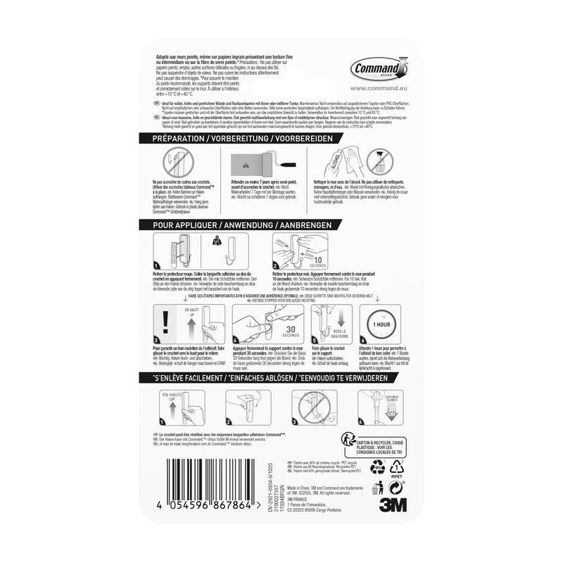 Rückseite des 3M Deutschland GmbH Mittelgroßer Command™ mattschwarzer Haken, 17034B, zeigt mehrsprachige Anleitung mit Diagrammen zur Anwendung und Entfernung, Schritt-Symbolen und einem Barcode; enthält 1 Haken und 2 Strips.
