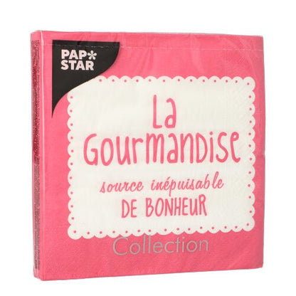 A pink package PAPSTAR 20 napkins, 33x33 cm, 3-ply, with a white, wavy label bearing the inscription "La Gourmandise, source inépuisable de bonheur." "PAP STAR" is written in the upper left corner, and "Collection" is written at the bottom.