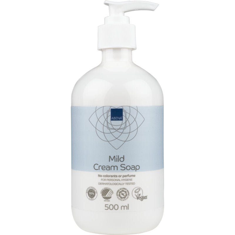 A white plastic pump bottle labeled "Mild Cream Soap without Perfume" by Abena Re-Seller GmbH, featuring a blue-white design. The 500 ml product is dermatologically tested, vegan, and has certifications on the label.