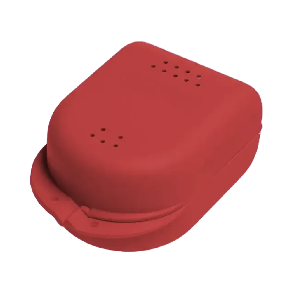 A red, rectangular AMPri PP Dental braces box for children from AMPri Handelsgesellschaft mbH is made of polypropylene and features a rounded lid with small perforations at the top. It has a closure to secure the lid, making it a practical choice for organizing various items.