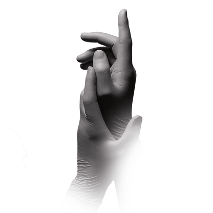 A pair of hands wearing MED-COMFORT’s AMPri STYLE PLATINUM powder-free nitrile gloves, in silver-gray from AMPri Handelsgesellschaft mbH, are positioned against a white background. The right hand is raised slightly, with the fingers curled upward, while the left hand is positioned lower and partially obscured by the right hand, highlighting its powder-free design.