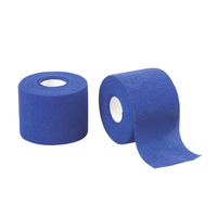 Two rolls B. Braun Askina® Haft color Adhesive Bandage, blue, by B. Braun Deutschland GmbH & Co. KG. One roll is standing upright with a piece of tape unrolled from it, while the other roll is lying on its side. Both have a white inner core.