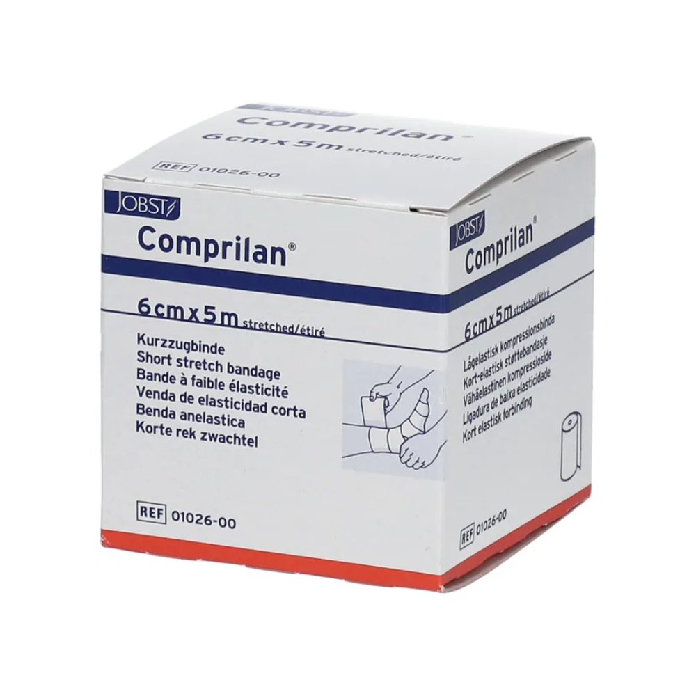 The picture shows a box of BSN Comprilan® elastic bandage, a compression bandage from BSN Medical GmbH, with dimensions of 6 cm x 5 m. The packaging contains multilingual information and an illustration demonstrating the application of the bandage on a leg.