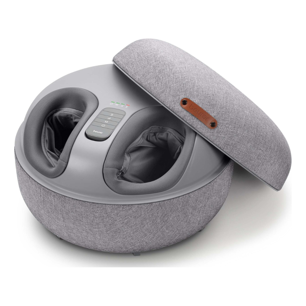 The Beurer FM 120 2-in-1 Shiatsu foot massager from Beurer GmbH is a gray device with a fabric-covered, partially open lid that reveals two foot slots for reflexology massage and a control panel with buttons and indicator lights on the top.