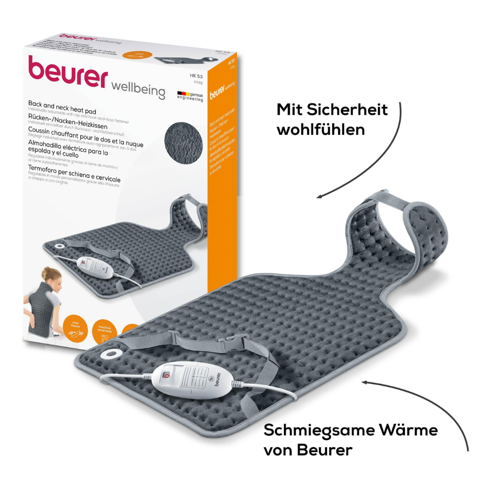 Das Beurer HK 53 Rücken-/Nacken-Heizkissen der Beurer GmbH verfügt über eine benutzerfreundliche Bedieneinheit, während auf der Verpackung Produktdetails und Bilder angezeigt werden. Dieses graue Kissen hat eine strukturierte Oberfläche und verfügt über einen Riemen zur Nackensicherung sowie die zusätzliche Sicherheit des Beurer Sicherheitssystems.