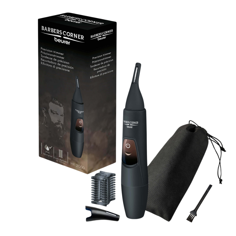 The image shows a Beurer HR 2000 precision trimmer from Beurer GmbH, ideal as an eyebrow trimmer. The trimmer is black and is displayed next to its packaging, which includes two trimming attachments, a small cleaning brush, and a black carrying case. The packaging contains product details and an illustration.