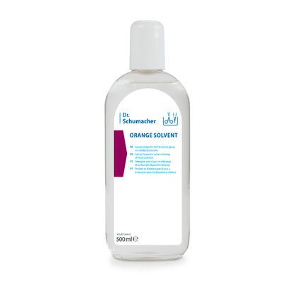 A transparent 500-ml bottle of Dr. Schumacher GmbH ORANGE SOLVENT Instrument Cleaner with a white cap and a blue-and-white label, designed for adhesive removal and instrument cleaning, shown against a white background.
