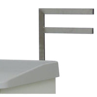 A close-up shows the Novocal F bracket (330 mm), in a metallic finish, with a two-part F-shaped structure mounted on the right side of a white surface with a gray top; 1 piece per package.