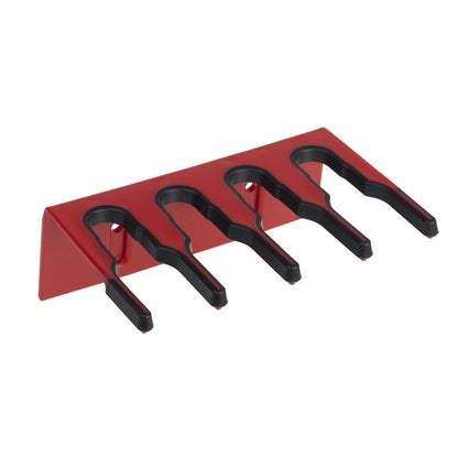 The PLASTIC DEVICE STRIP 200X70X125 MM from Haug Bürsten KG is a red, triangular plastic shelf with four black slots for organizing tools, depicted on a white background.