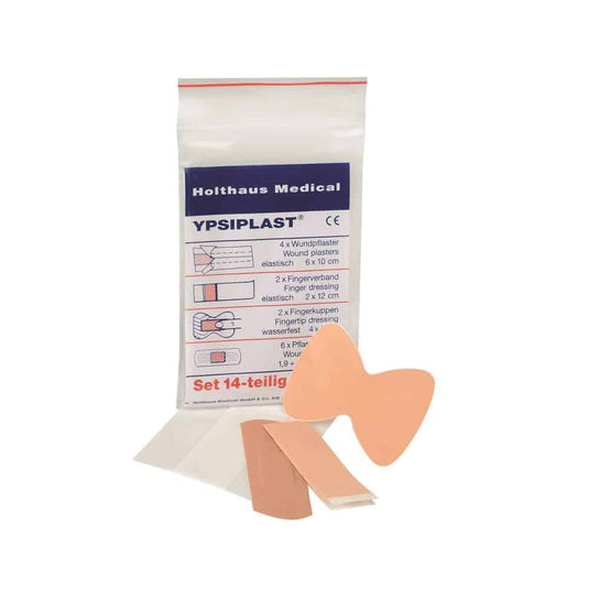 Pictured is a package of Holthaus Medical YPSIPLAST® plaster set, DIN from Holthaus Medical GmbH & Co. KG. The 14-piece set includes 4 wound plasters (6 x 10 cm), 2 fingertip and finger bandages, 2 butterfly wound plasters, and 6 small adhesive plasters. Some of the items are shown outside of the package.