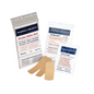 Holthaus Medical GmbH & Co. KG offers the Holthaus First Aid Mini Kit – 5-piece, which includes a quick bandage, large bandage, additional bandage, and a quick compress. The packaging is labeled with a German instruction manual.