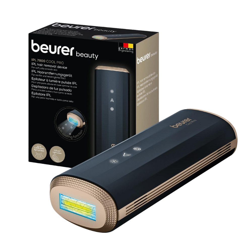 Image of a Beurer IPL hair removal device IPL 7800 COOL PRO by Beurer GmbH in black and gold. The device is depicted on the front of its packaging, showing product details and images. It has a rectangular shape with an illuminated display at one end.